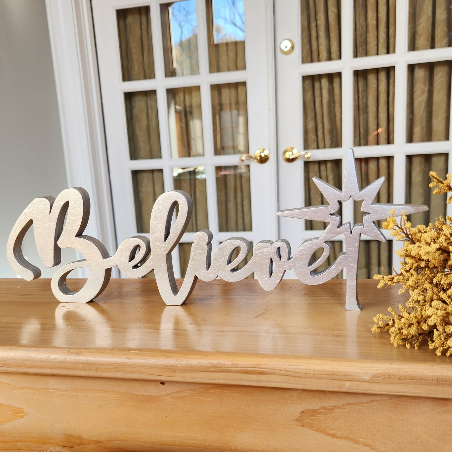 Free-standing wood Believe sign