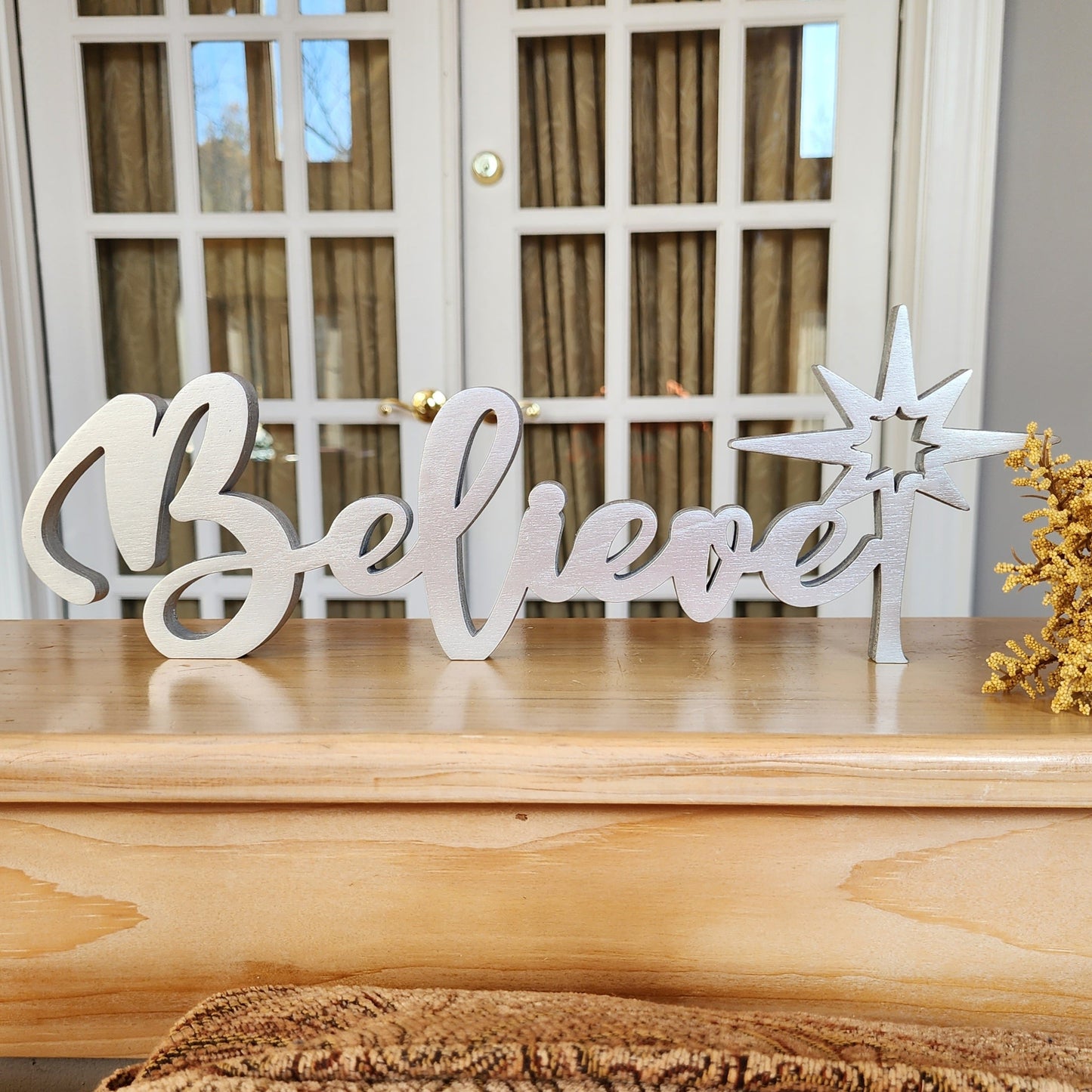 Free-standing wood Believe sign