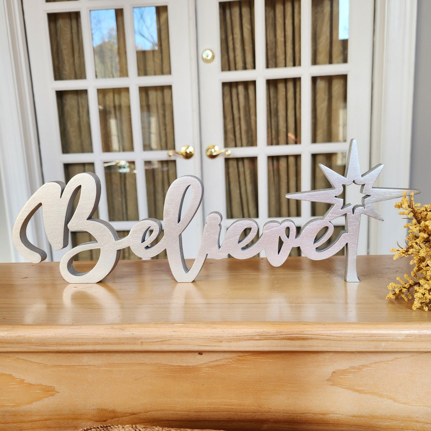 Free-standing wood Believe sign